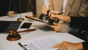 Lawyer, legal advisor, businessman brainstorming information on agreement details Business contracts in legal processing books for accuracy in contract documents.